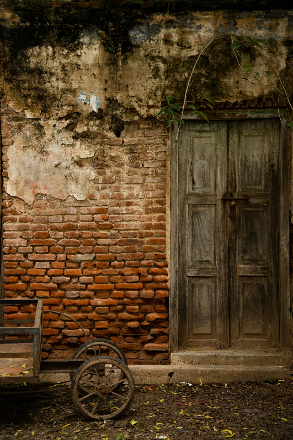 an old brick building with a wooden door