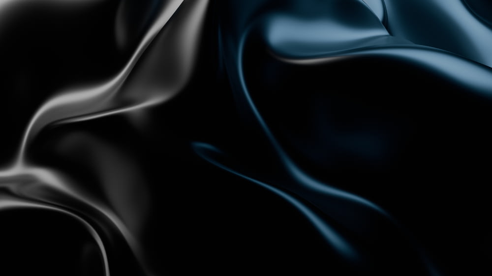 a black and blue background with some folds