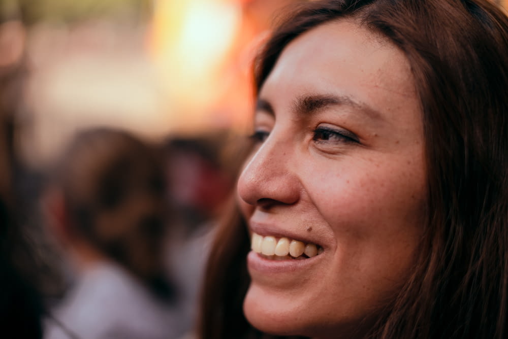 a close up of a person with a smile on her face