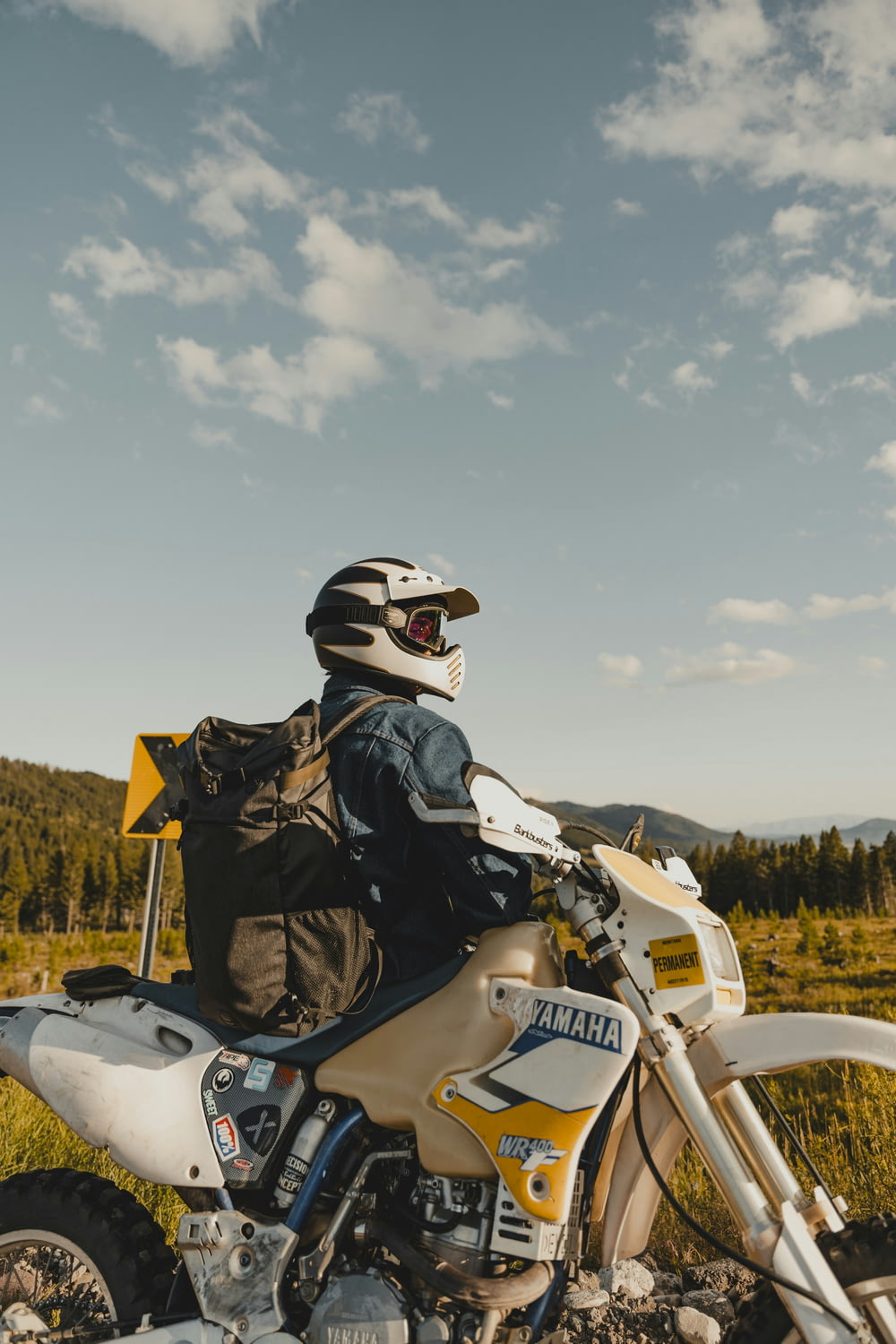 a person on a dirt bike with a back pack