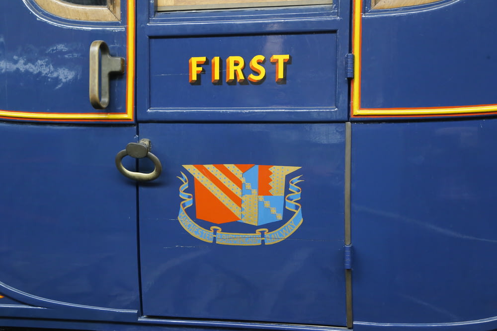 a close up of the door of a blue bus