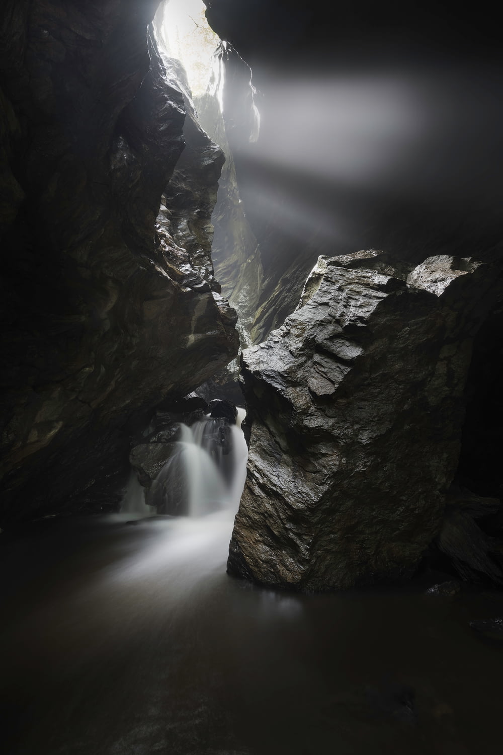 a long exposure of a waterfall in a cave