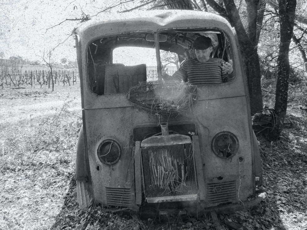 a black and white photo of an old truck