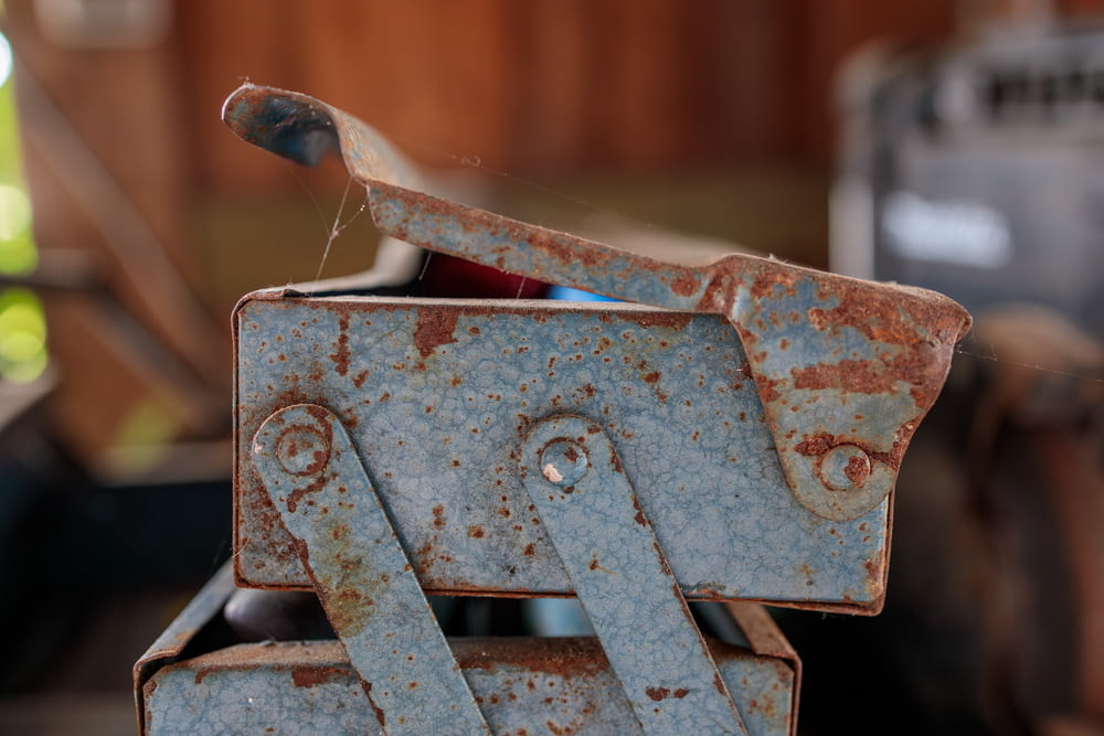 a rusted metal object sitting on top of a table