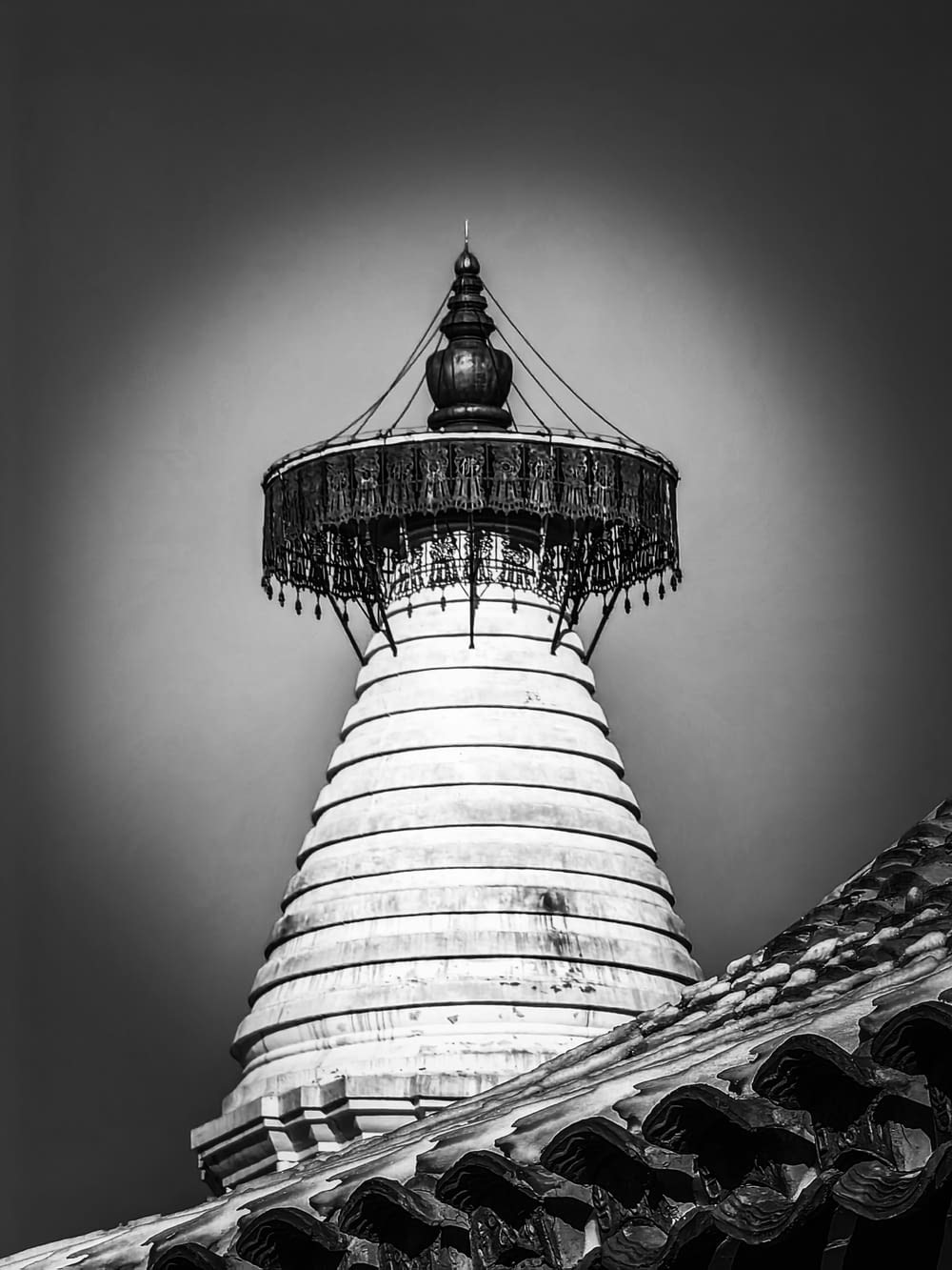 a black and white photo of a light house
