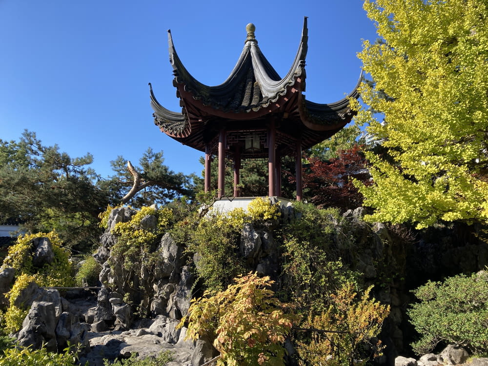 a pagoda in the middle of a rock garden