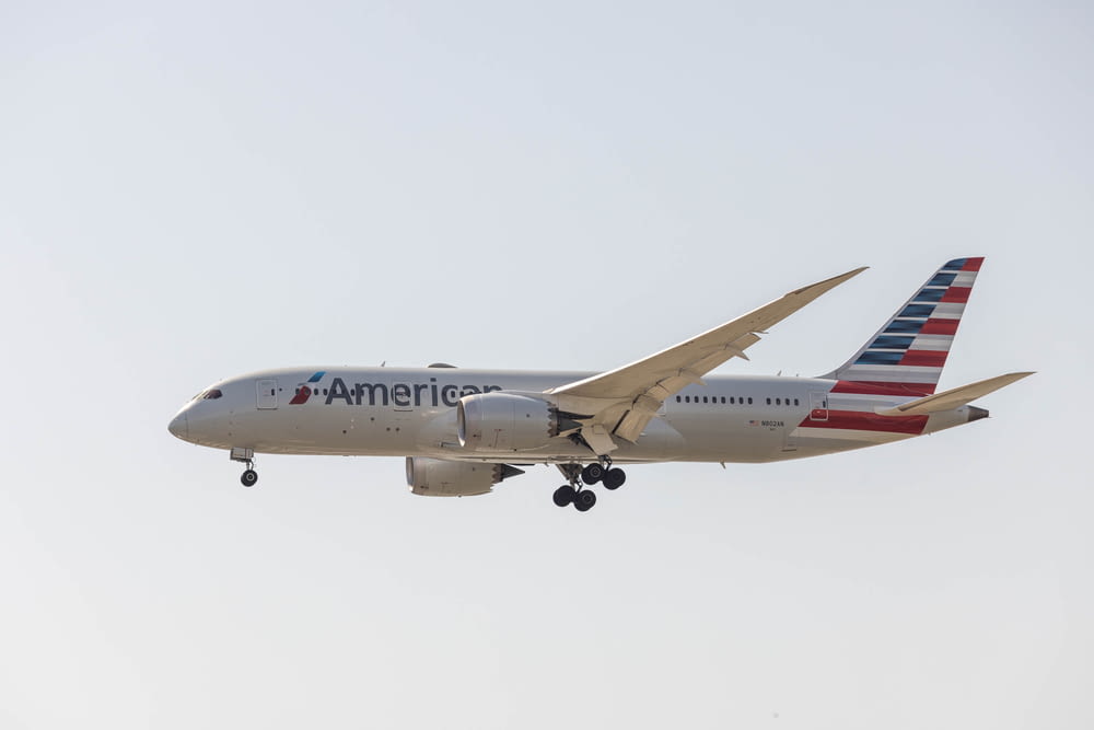 an american airlines plane flying in the sky