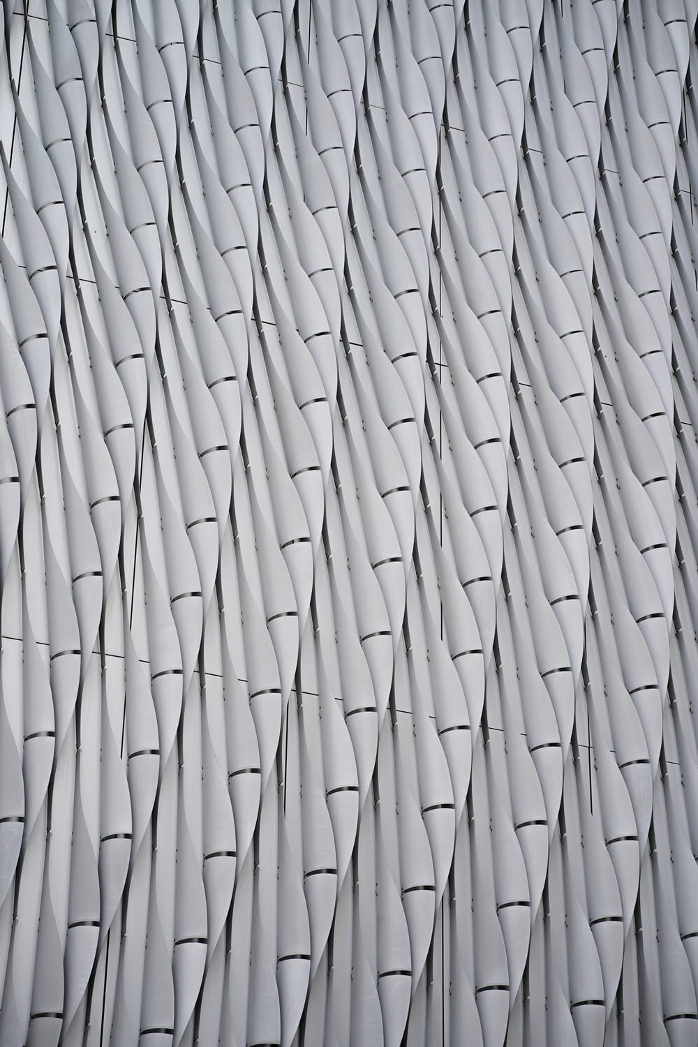 a close up of a wall made of wavy lines