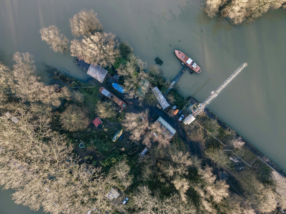 an aerial view of a boat dock on a river