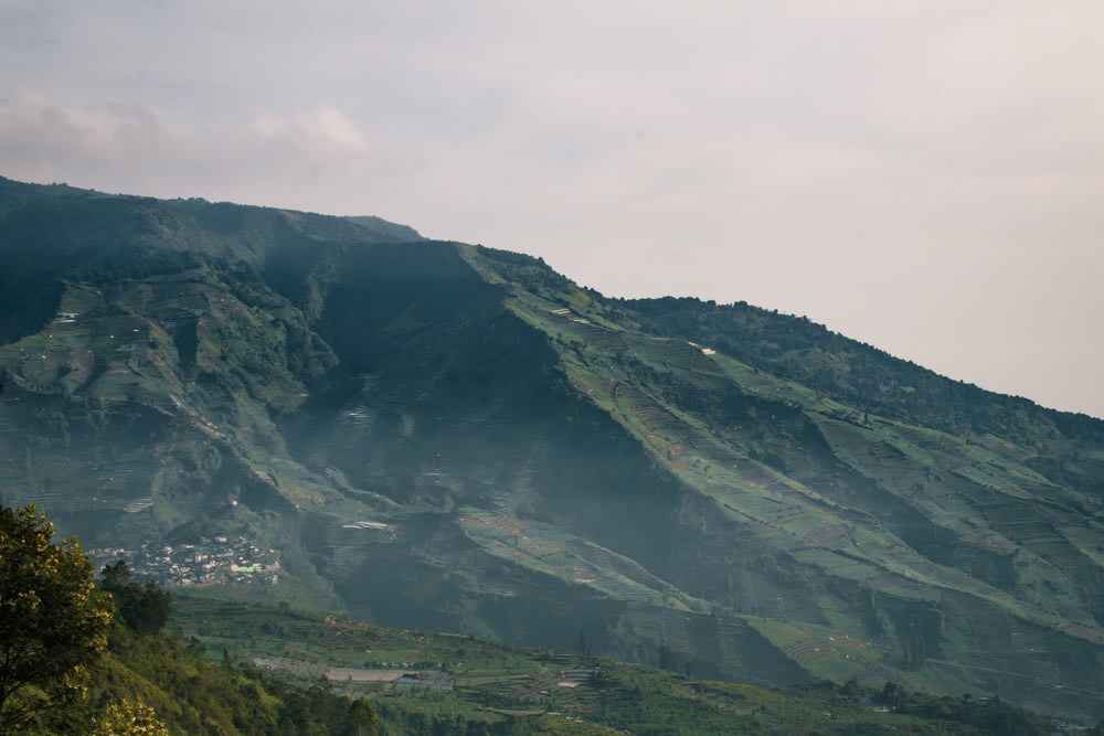 a view of a mountain with a village on the top of it