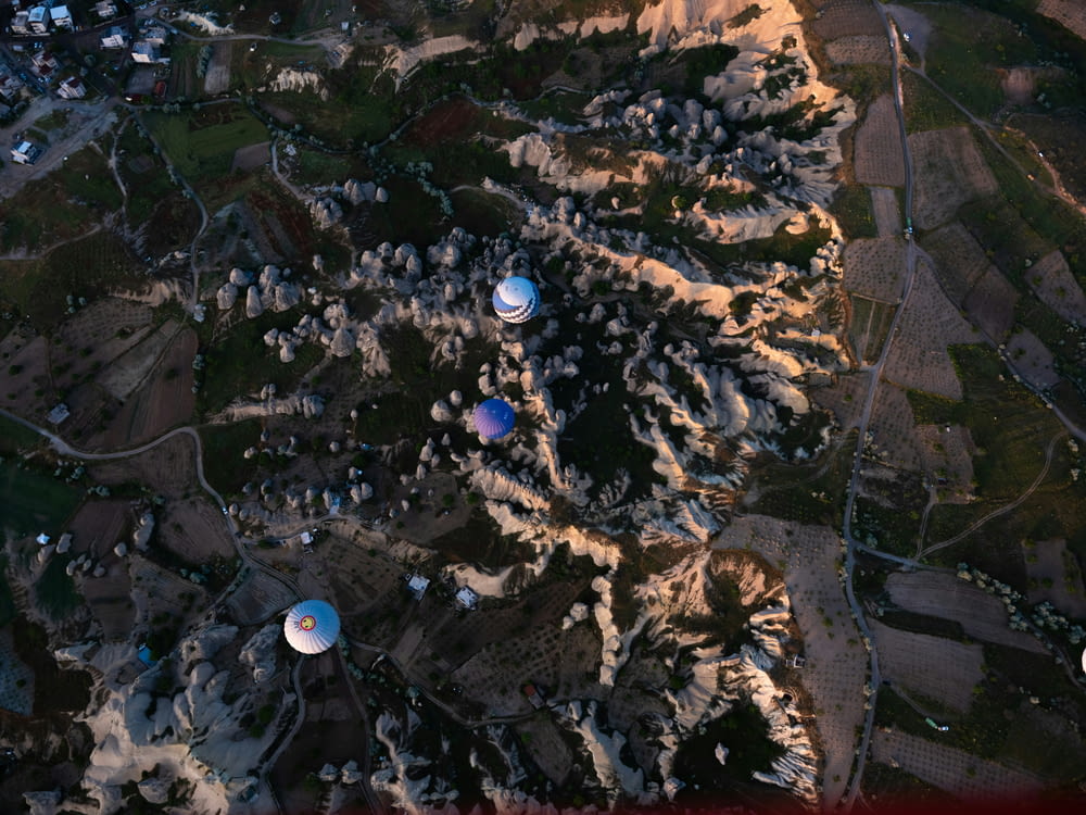 an aerial view of a mountain with several satellite dishes
