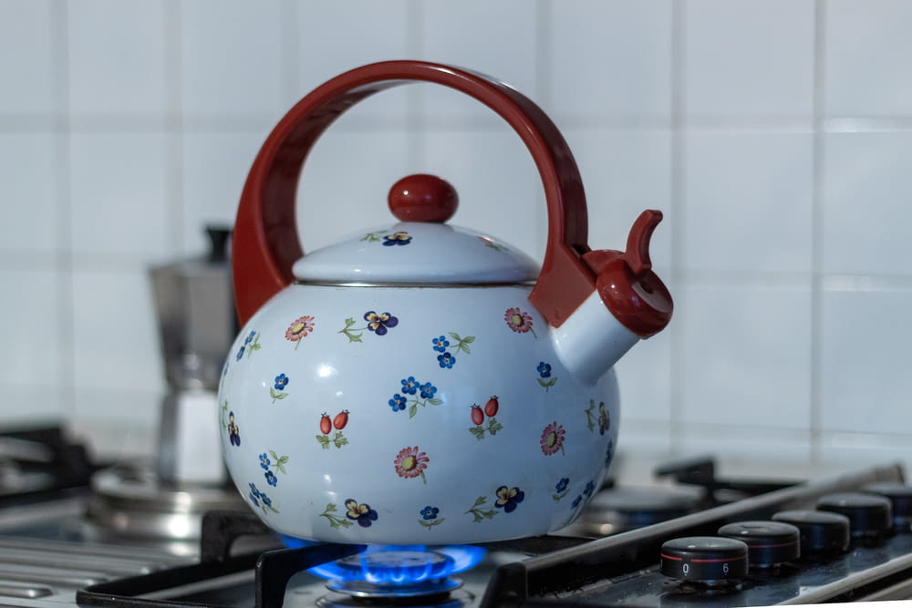 a tea kettle sitting on top of a stove