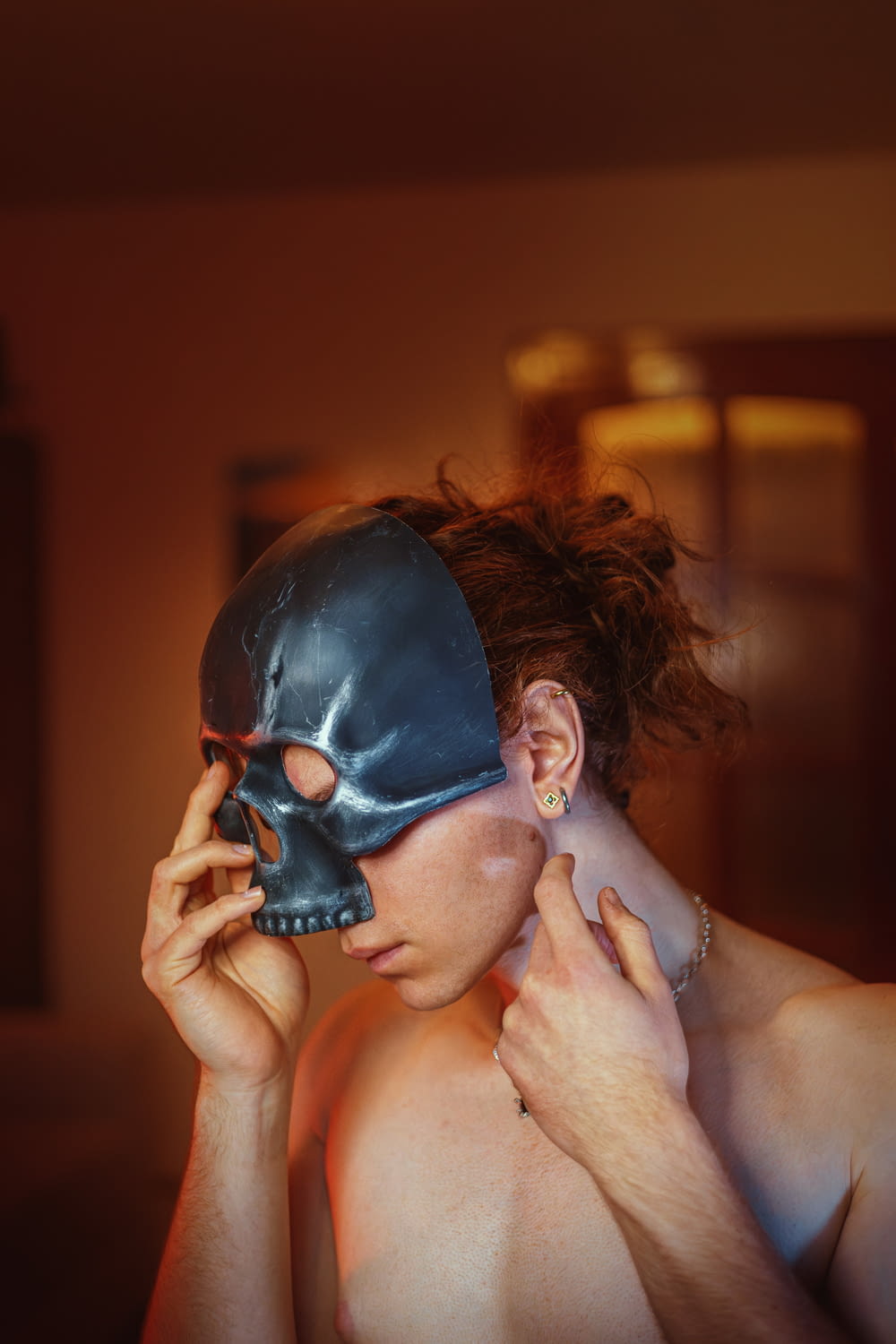 a woman with a skull mask covering her face