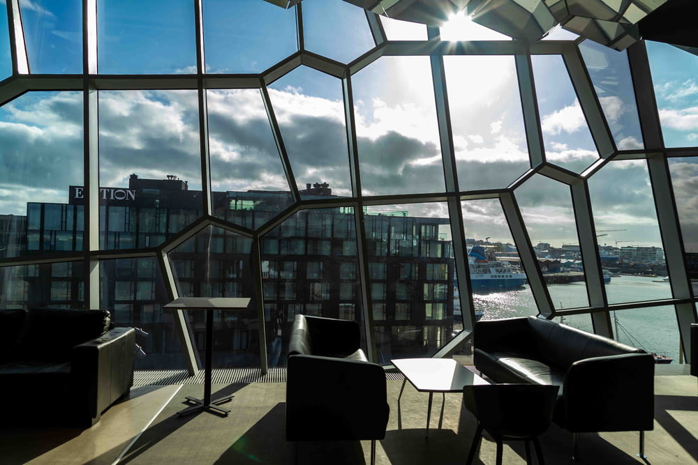 the sun shines through the windows of a modern building