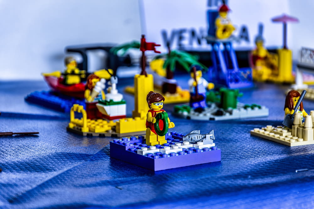 a table topped with legos and a blue table cloth