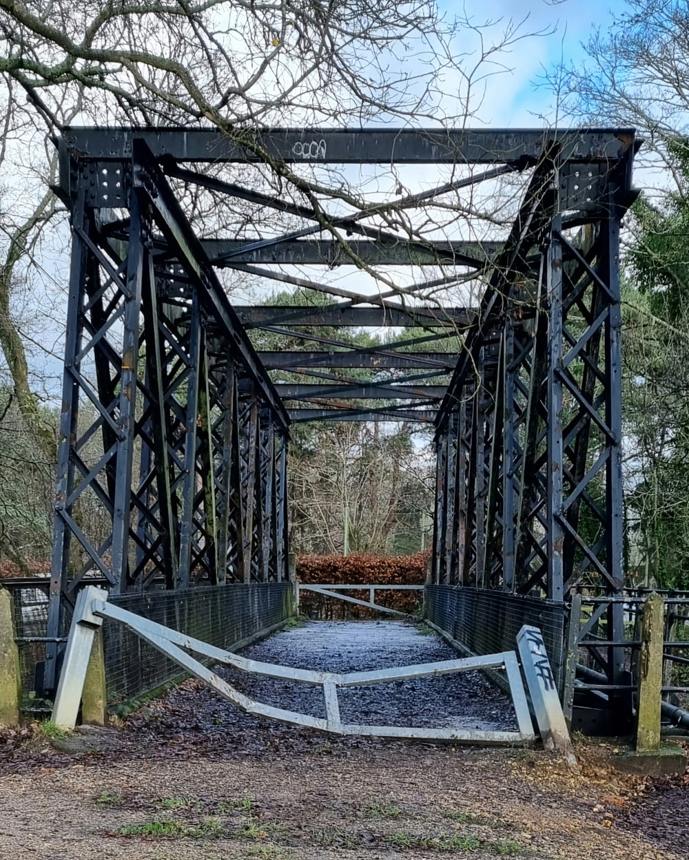 a metal bridge with a gate on top of it