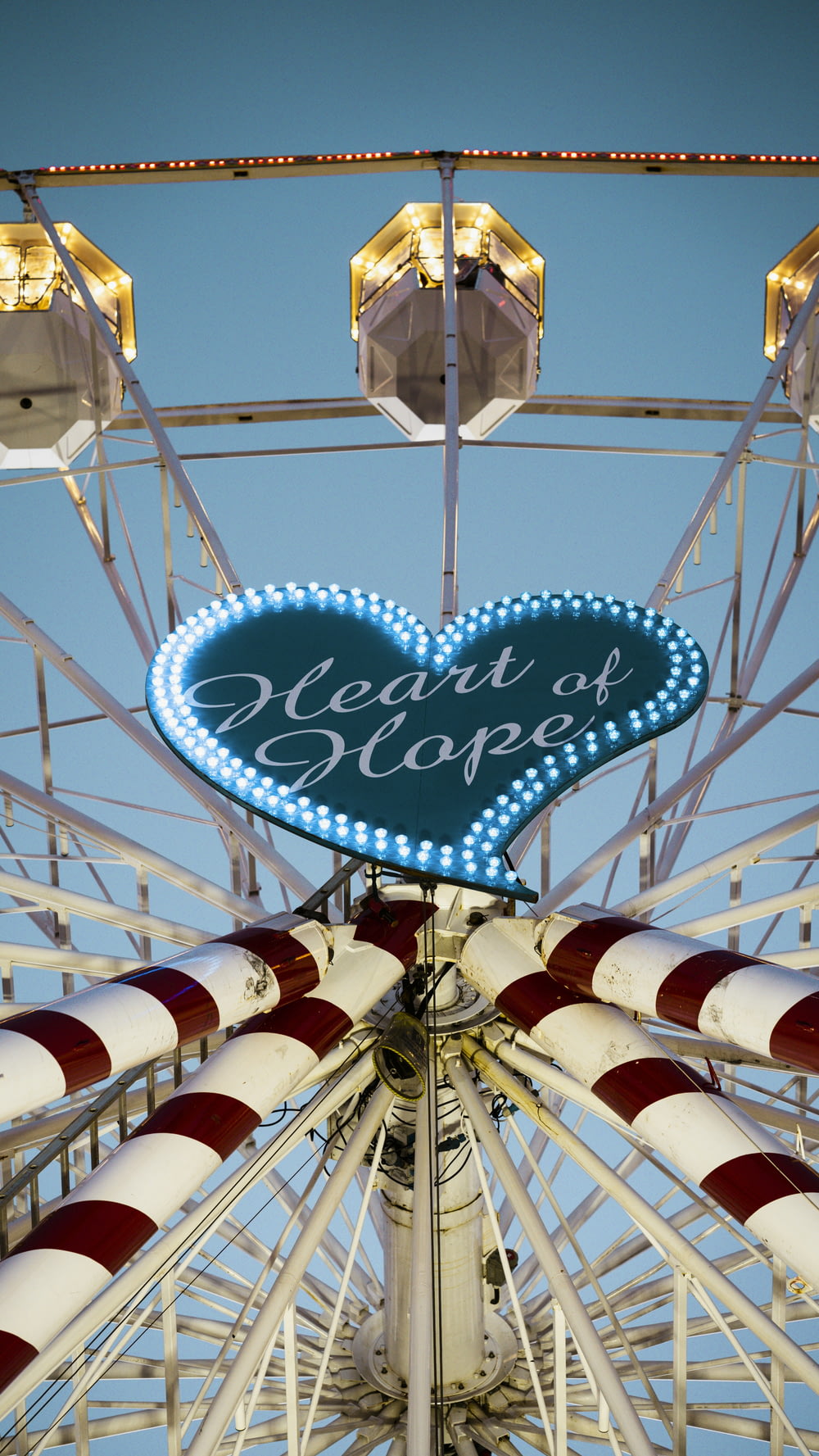 a ferris wheel with a heart shaped sign