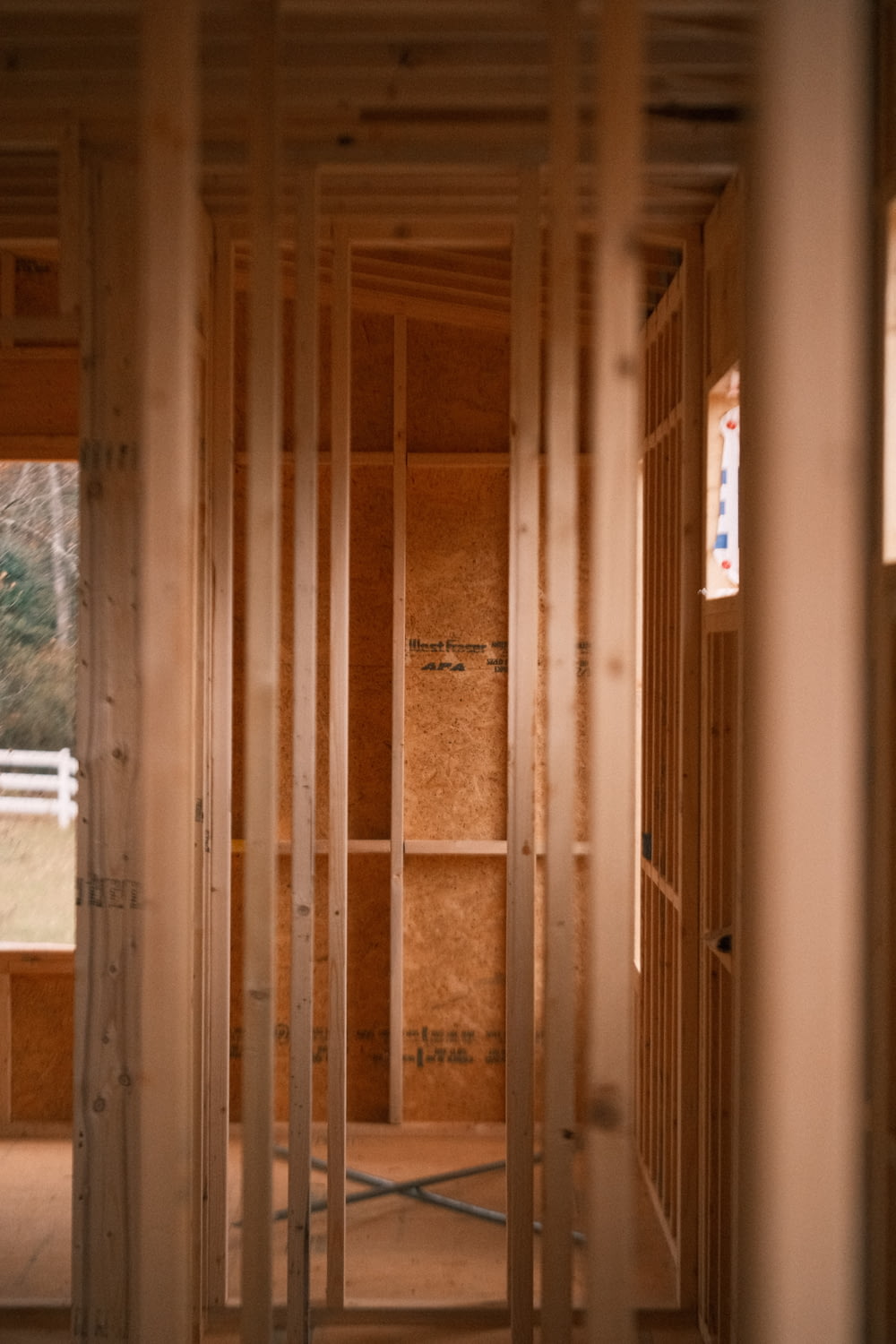 a room that is under construction with wooden framing