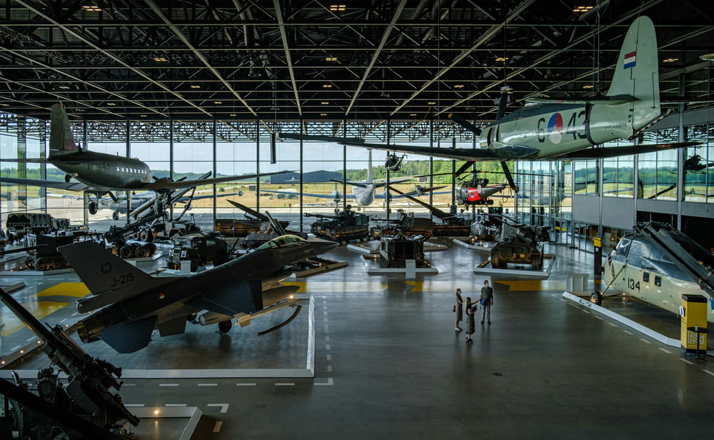 a hangar filled with lots of different types of planes