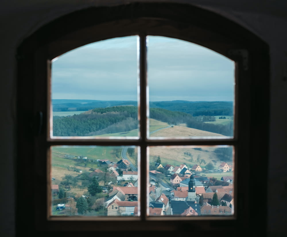 a window with a view of a small town