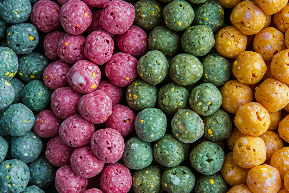 a close up of a bunch of different colored candies