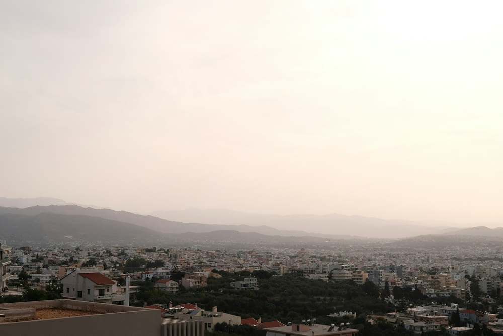 a view of a city with mountains in the distance