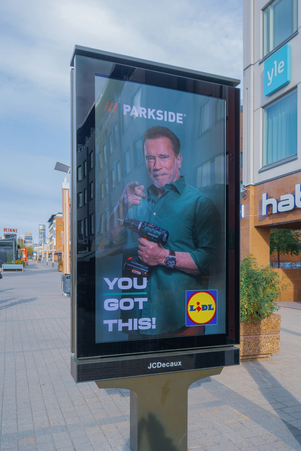 a billboard with a man holding a camera