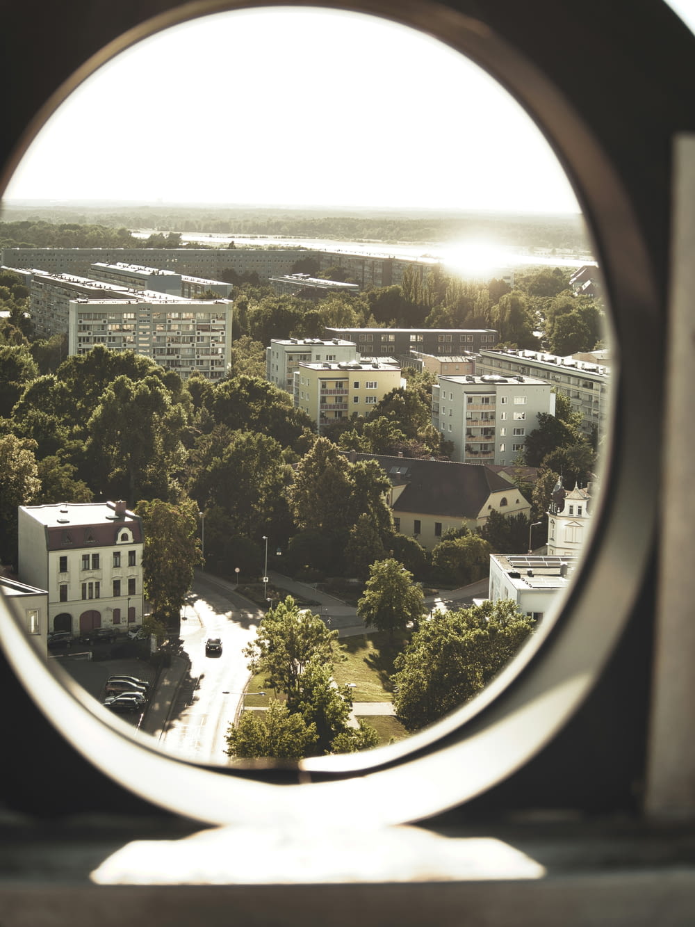 a view of a city through a round window