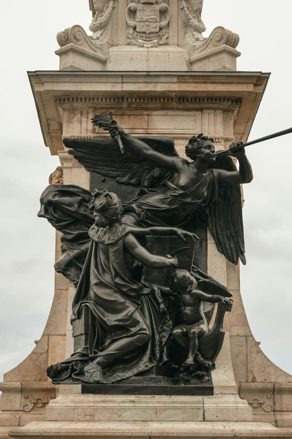 a statue of an angel holding a sword