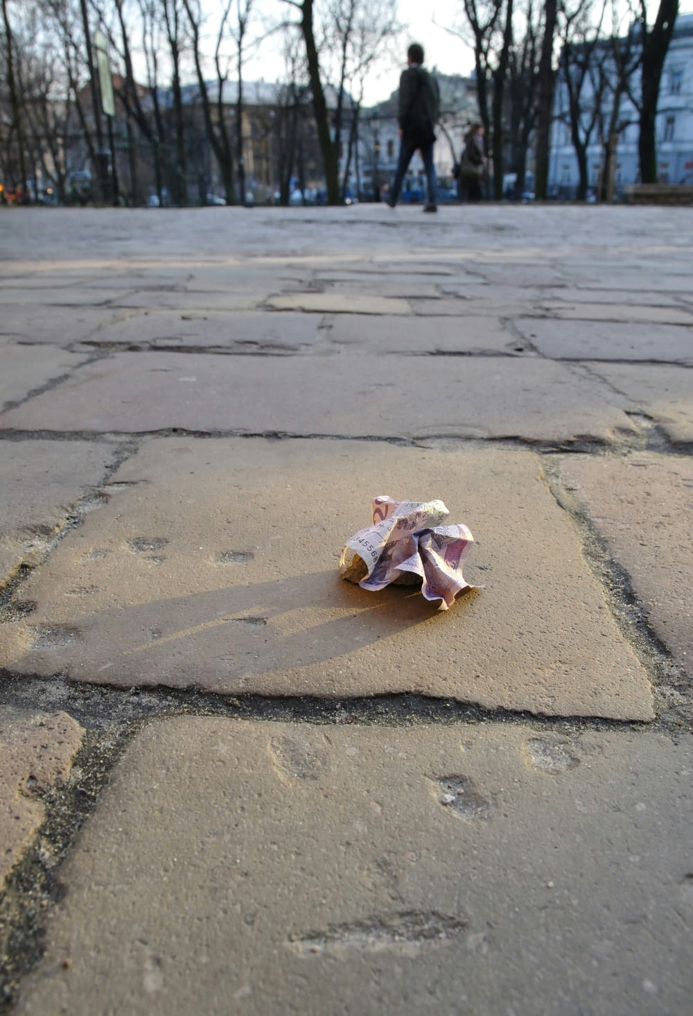 a crumpled piece of paper sitting on the ground