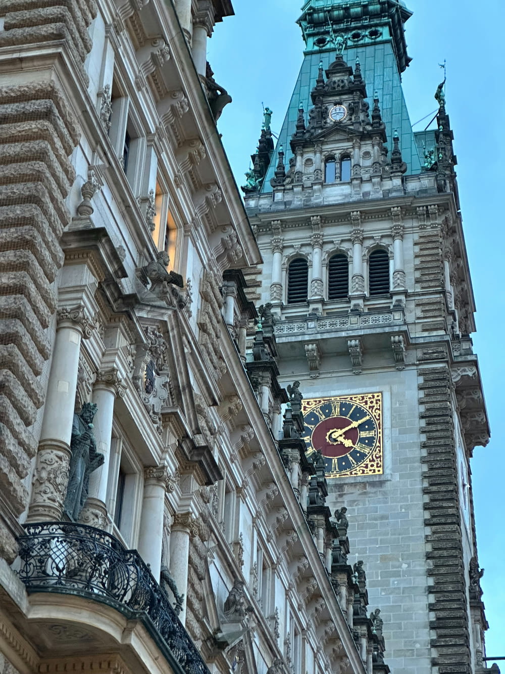 a clock on a building with a sky background