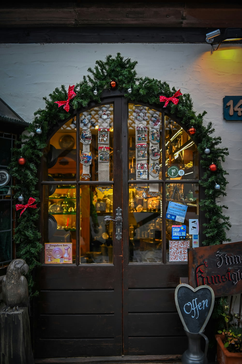 the front door of a restaurant decorated for christmas