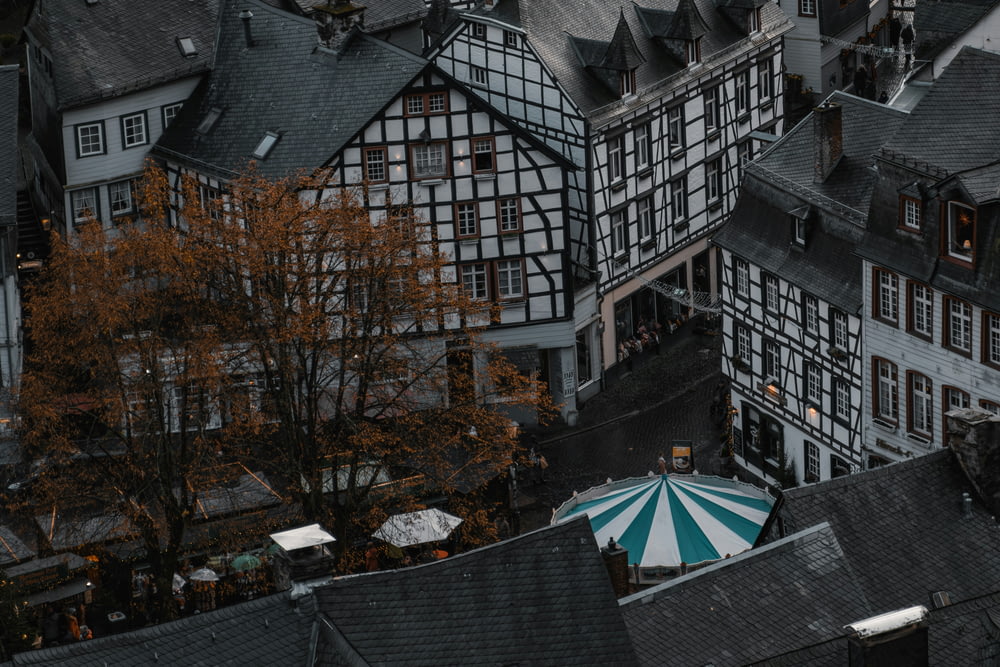 an aerial view of a building with a striped umbrella