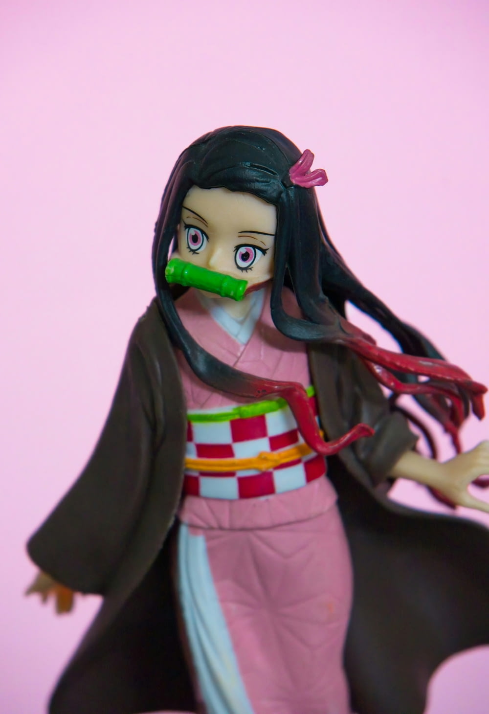 a figurine of a woman in a kimono