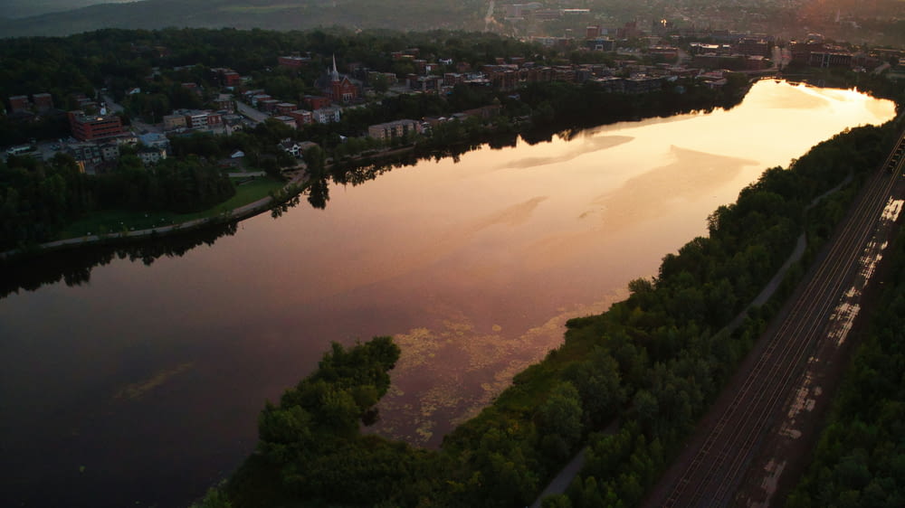 an aerial view of a river near a city