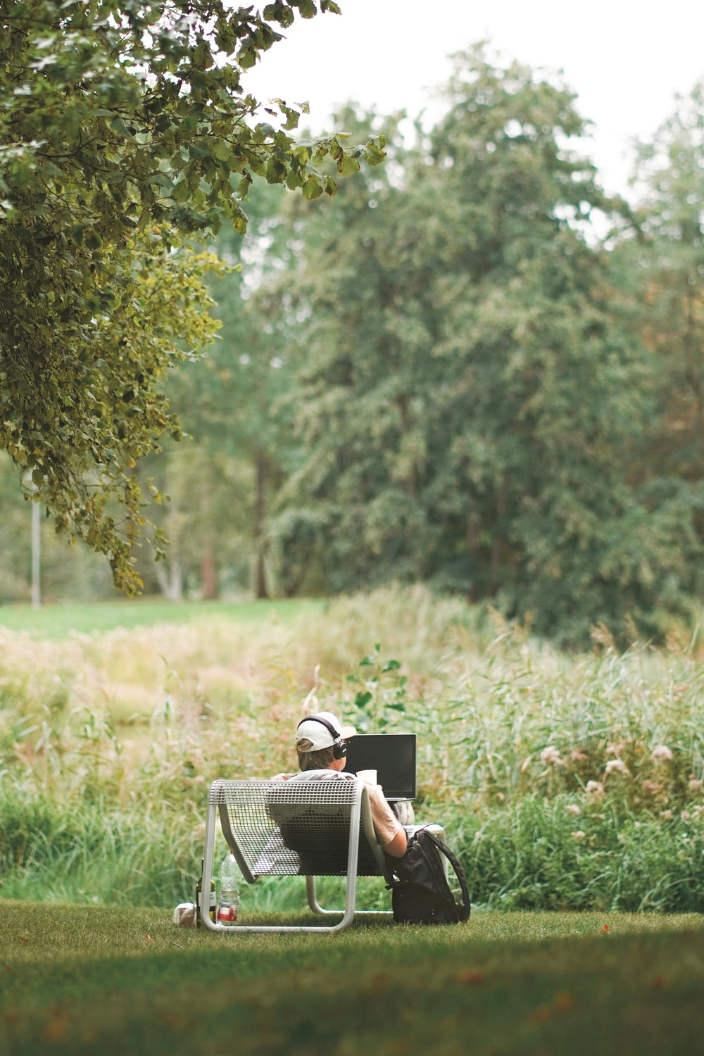a person sitting in a chair in a field