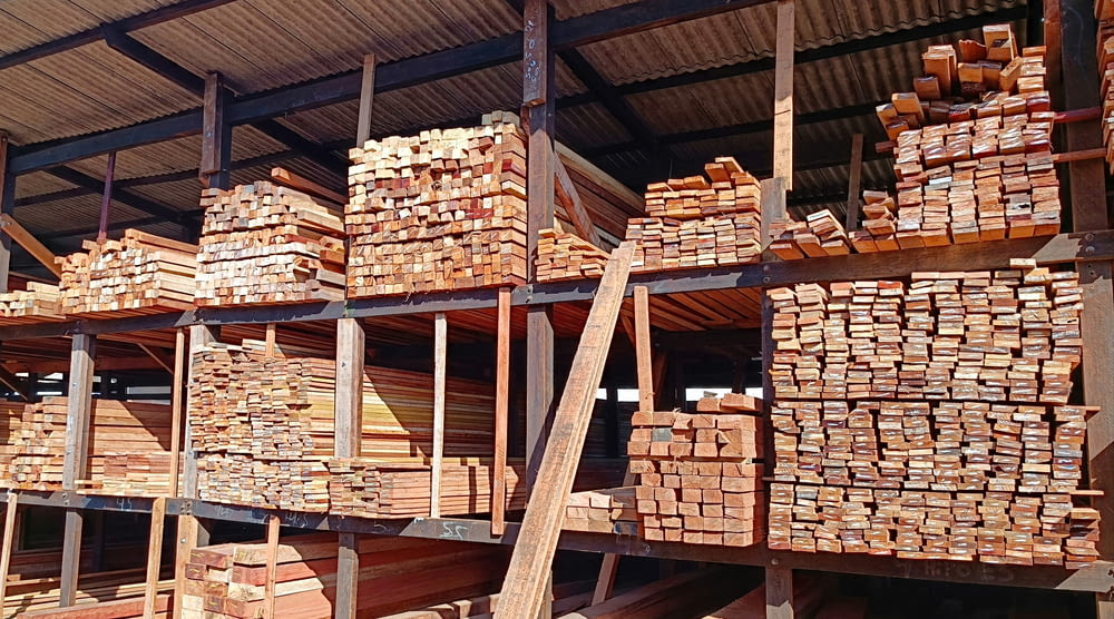 stacks of wooden planks in a warehouse