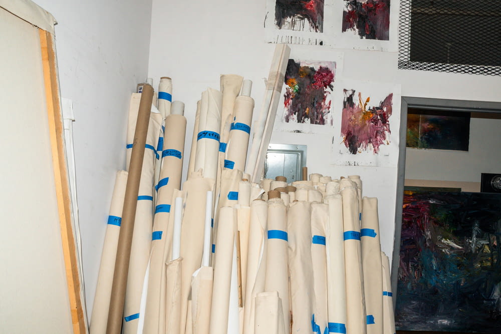 a bunch of white and blue poles in a room