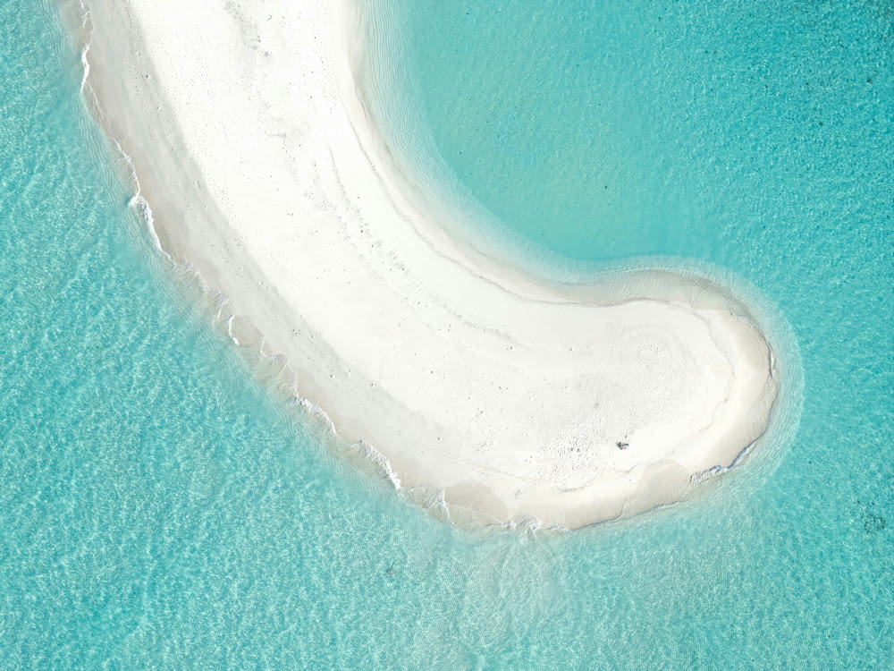 an aerial view of a white sand beach