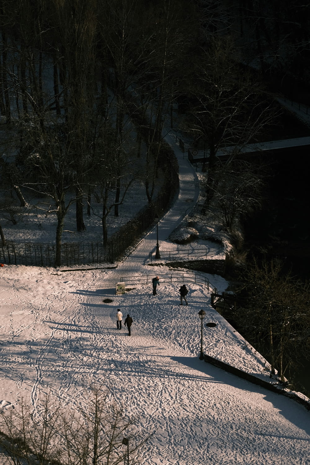 a group of people skiing down a snow covered slope