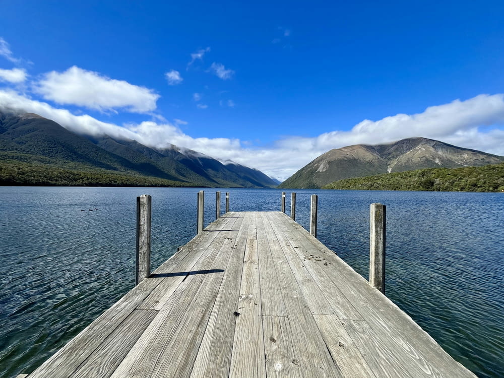 a wooden dock sitting on top of a lake
