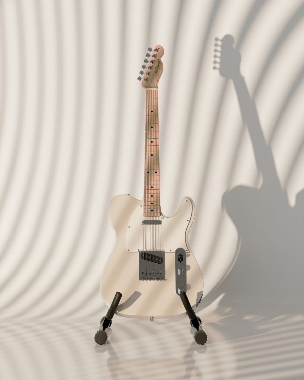 una chitarra elettrica bianca seduta sopra un supporto