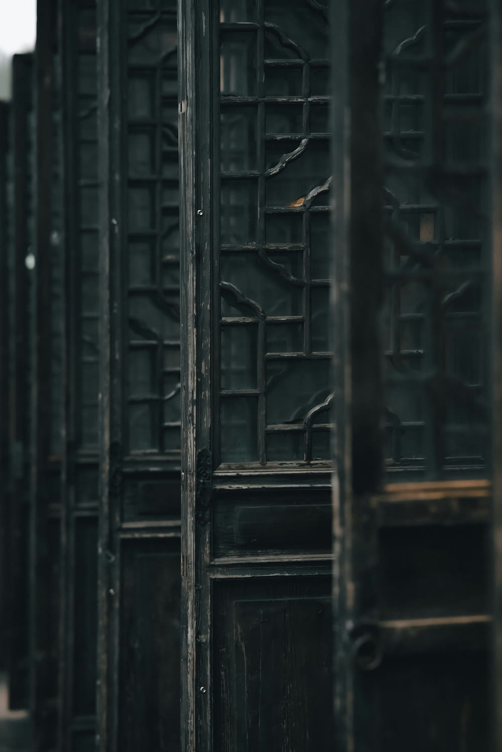 a row of wooden doors sitting next to each other