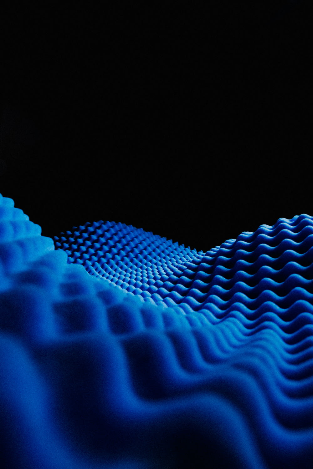 a black background with a blue wave pattern