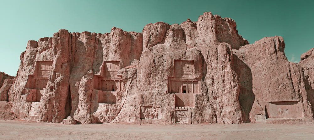 a rock formation with a house built into it