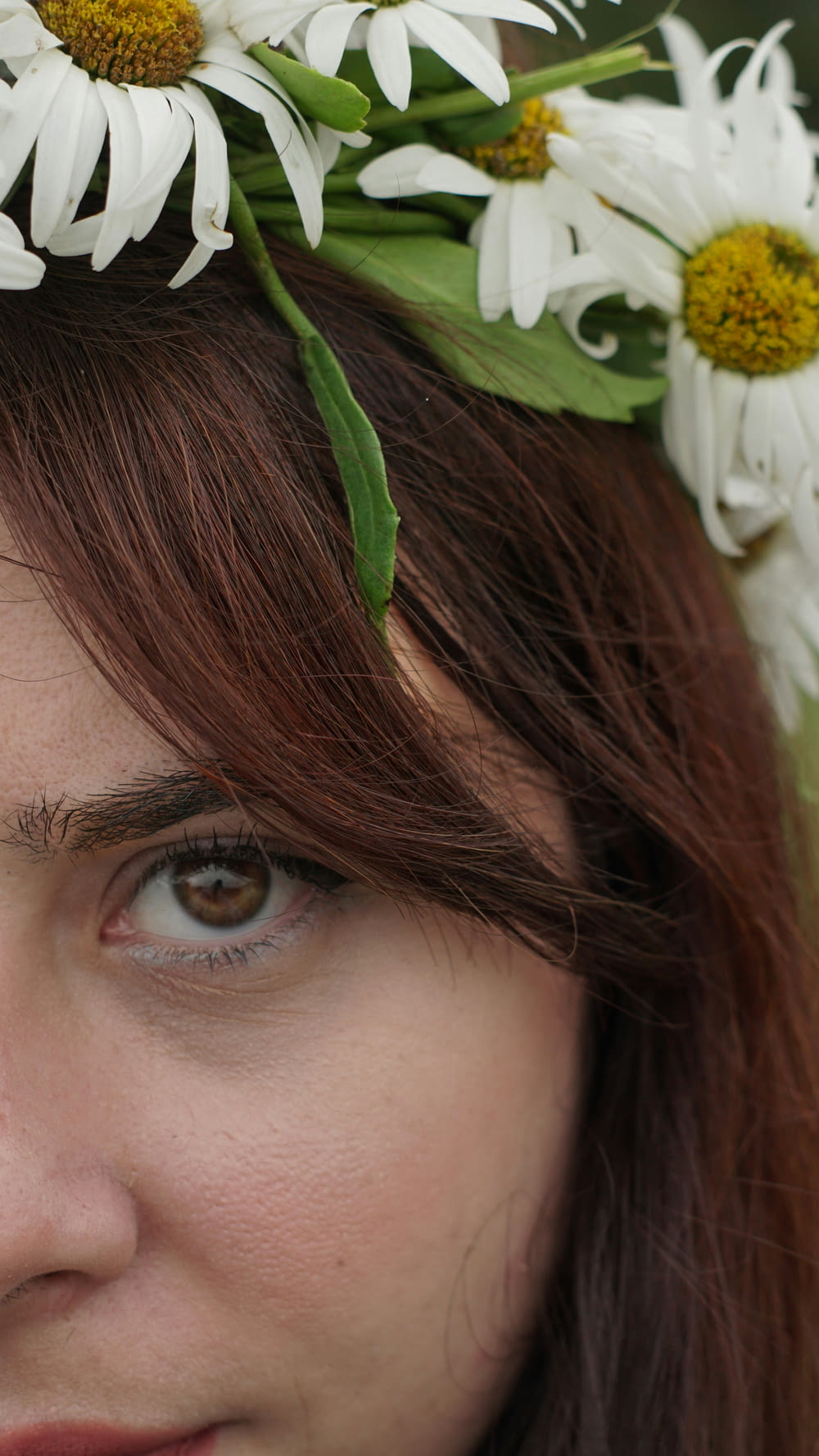 a woman with a flower crown on her head
