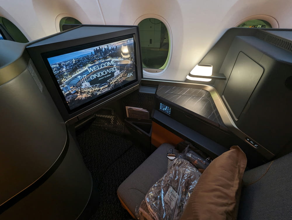 a view of the inside of an airplane with a television