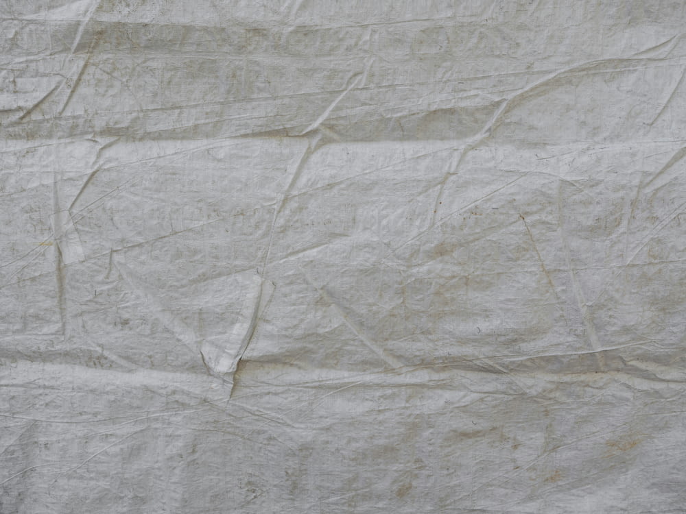 a piece of white paper that is wrinkled
