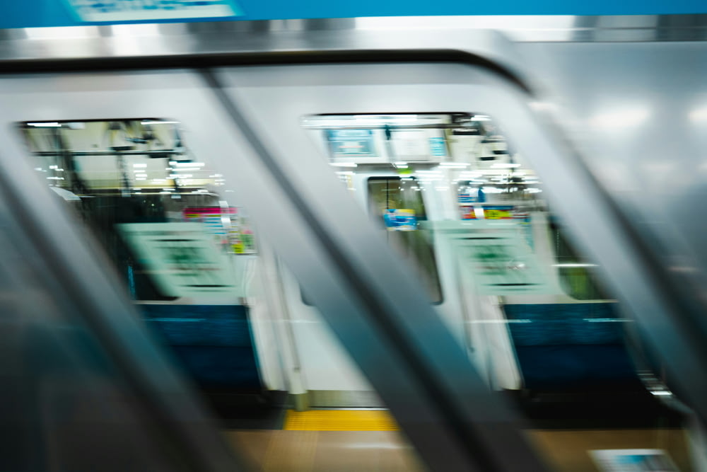 a blurry photo of a subway train with its doors open