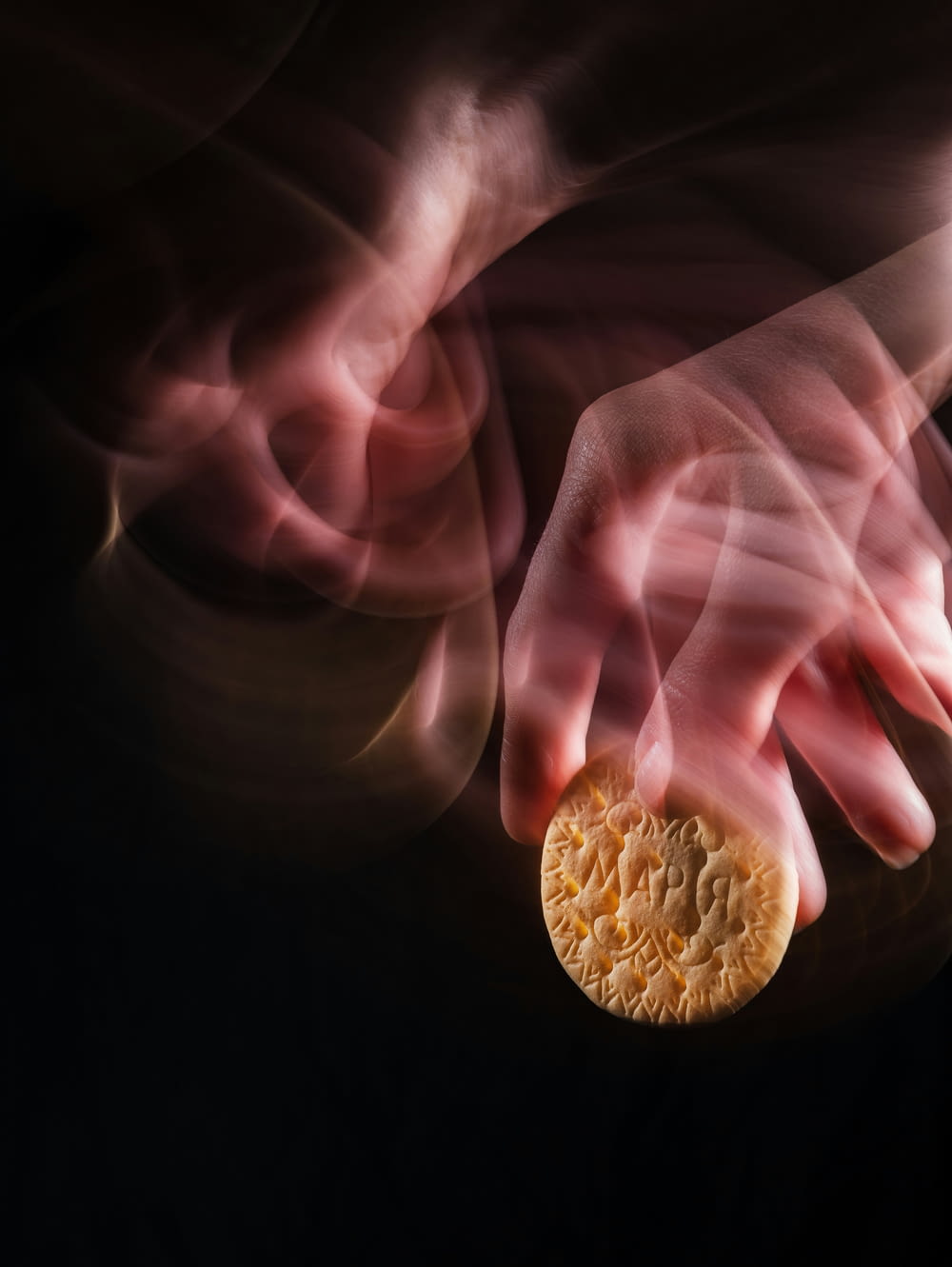 a close up of a person's hand holding a piece of food